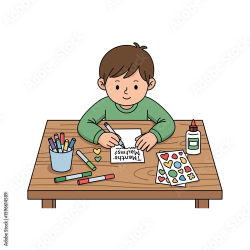 A young boy sits at a table, crafting a card with colorful markers, stickers, and glue.