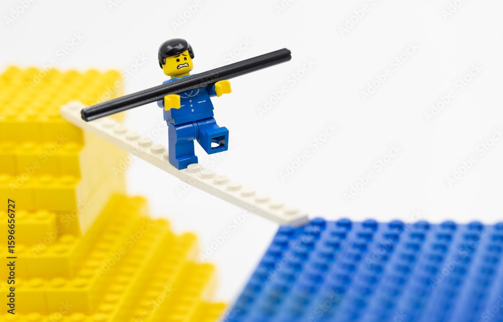 Obraz premium Hong Kong - July 21 2025: a man walk on a tightrope