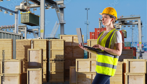 Female logistics worker wit...