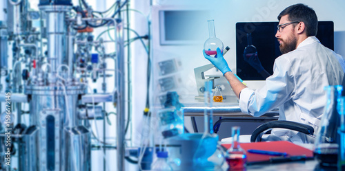 Man sitting in lab with bio...