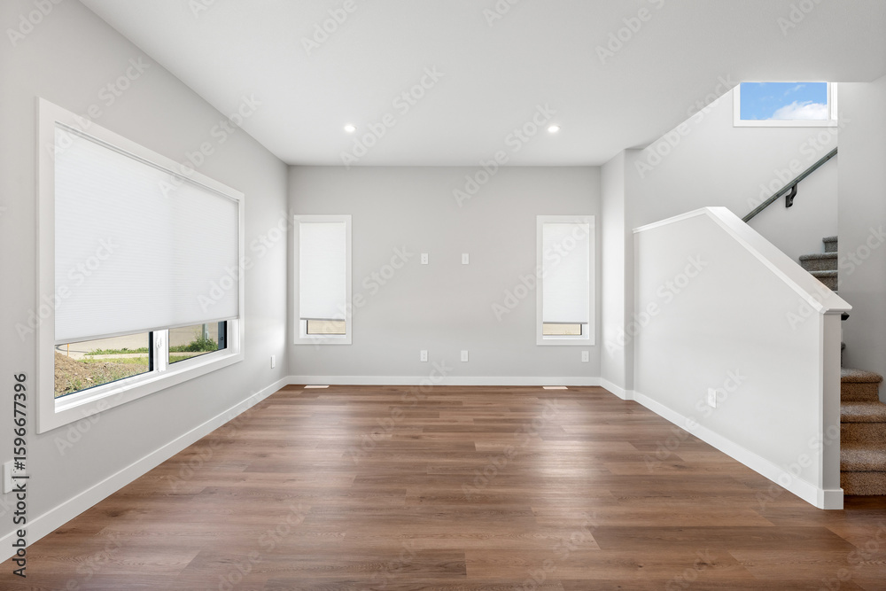 Fototapeta premium Large, empty room with a staircase in the background