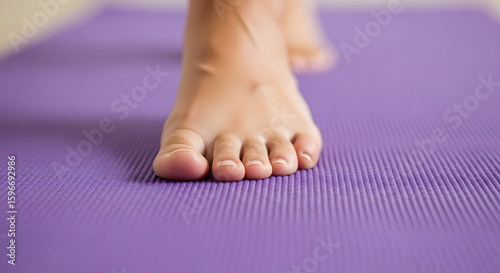 Close-Up of Barefoot Touching Yoga Mat with Strength and Intention