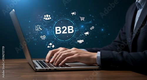 A businessman is typing on a laptop with b2b business to business marketing strategy icons, representing digital transformation and connection