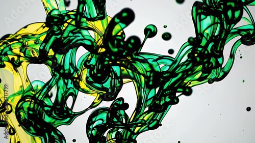 Unleash creative energy energetic K green and yellow ink blast blooming liquid suspension vibrant plumes mixing to form abstract art overlay design video intros music videos colourful branding