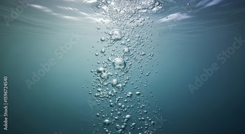 Fototapeta Naklejka Na Ścianę i Meble -  Bubbles Rising in Clear Blue Water Creates Abstract Aquatic Scene