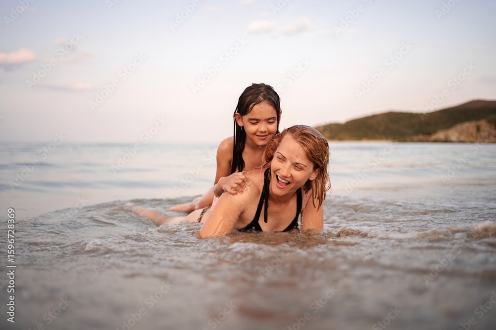 Laughter and splashes create unforgettable moments at the beach Laughter and splashes create unforgettable moments at the beach