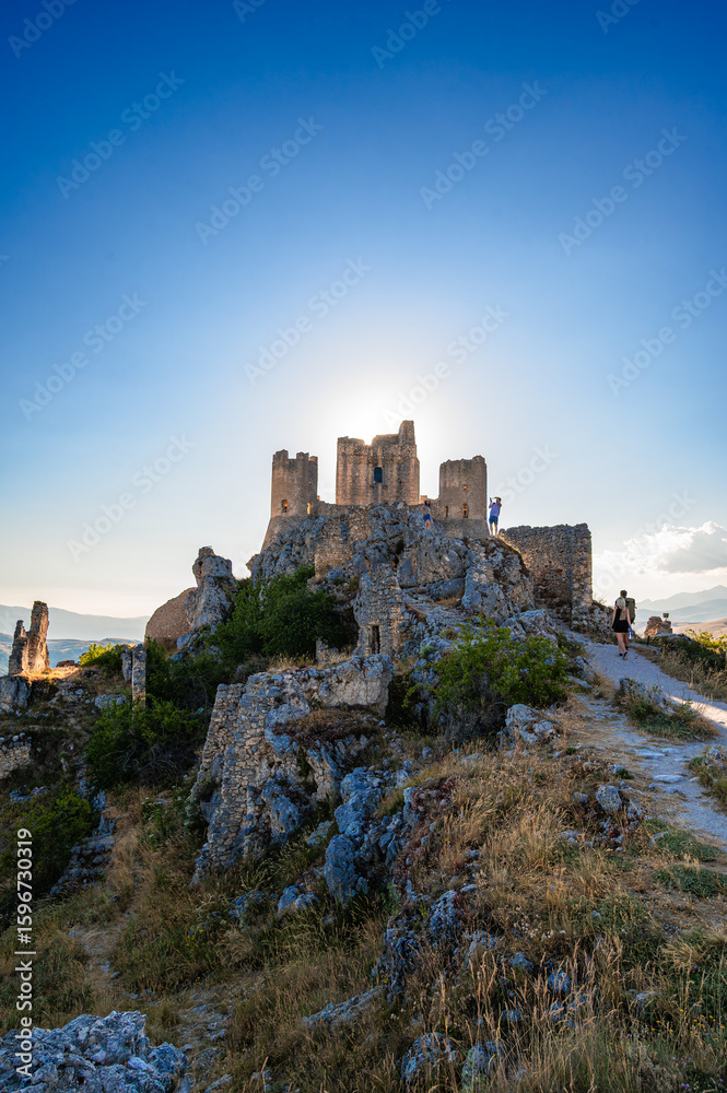 Obraz premium Italy, July 5, 2025: Ruins of Rocca Calascio Castle, an Italian tourist destination and landmark in the Gran Sasso National Park, L'Aquila, Abruzzo. Clear blue skies at .