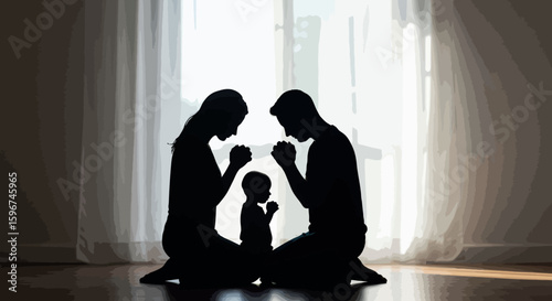 Silhouette family praying together at home in peaceful unity