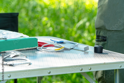 Scientific bird ringing tools on a research station table