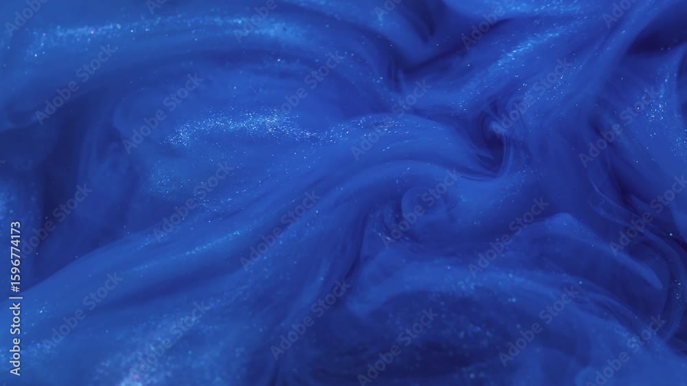 Smog ink. Vapor cloud. Defocused blue color splash in water explosion mix particles shiny fluid floating on abstract art background.