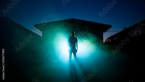 Silhouette man standing in light beam at night spooky mysterious encounter scene