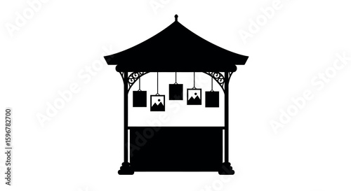 Silhouette of a traditional pavilion with hanging frames