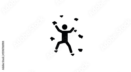 Silhouette of a person rock climbing on indoor wall with handholds