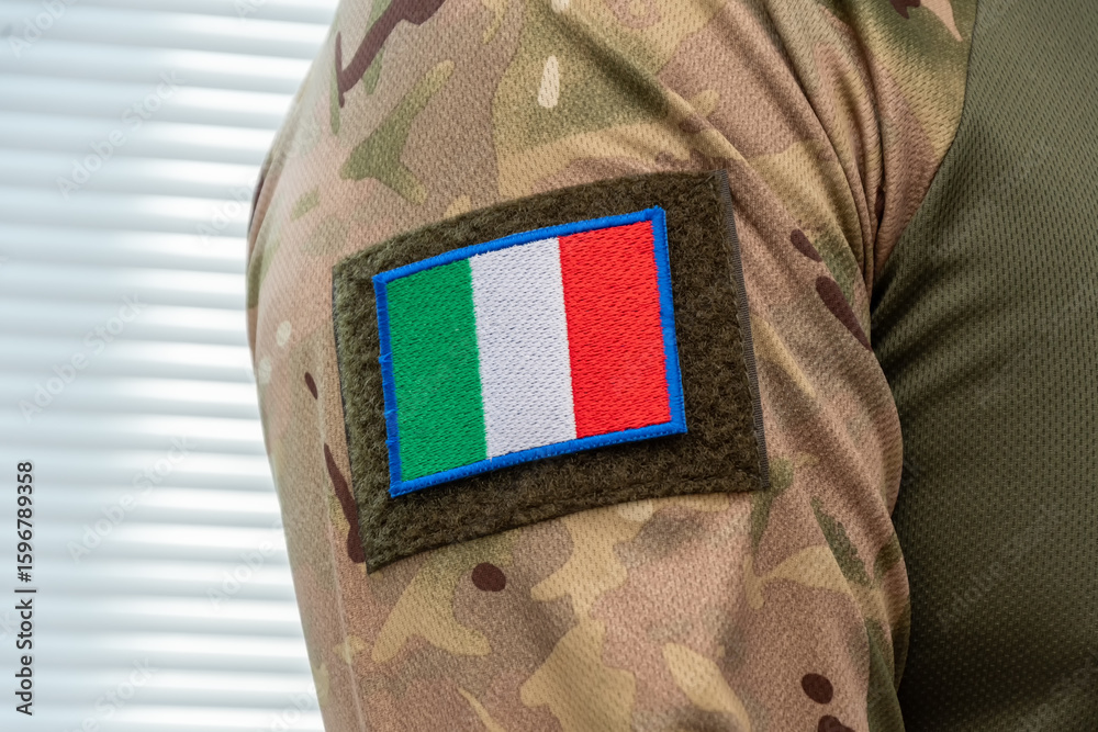 Fototapeta premium Modern military uniform with camouflage and Italian flag.