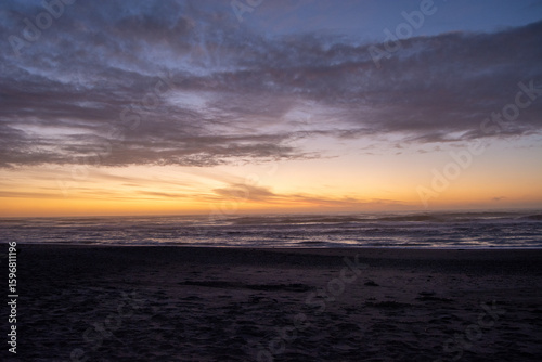 Serene Beach Sunset with Vibrant Sky Colors