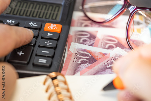 Financial settlements in the UK, financial analysis, tax calculation, risk costs, business project. British pound