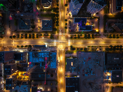 Photography Aerial view of illuminated intersection and construction in Amsterdam South