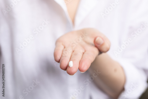 Quadro em tela Closeup of a person using topical treatment with azelaic acid for acne and hyperpigmentation