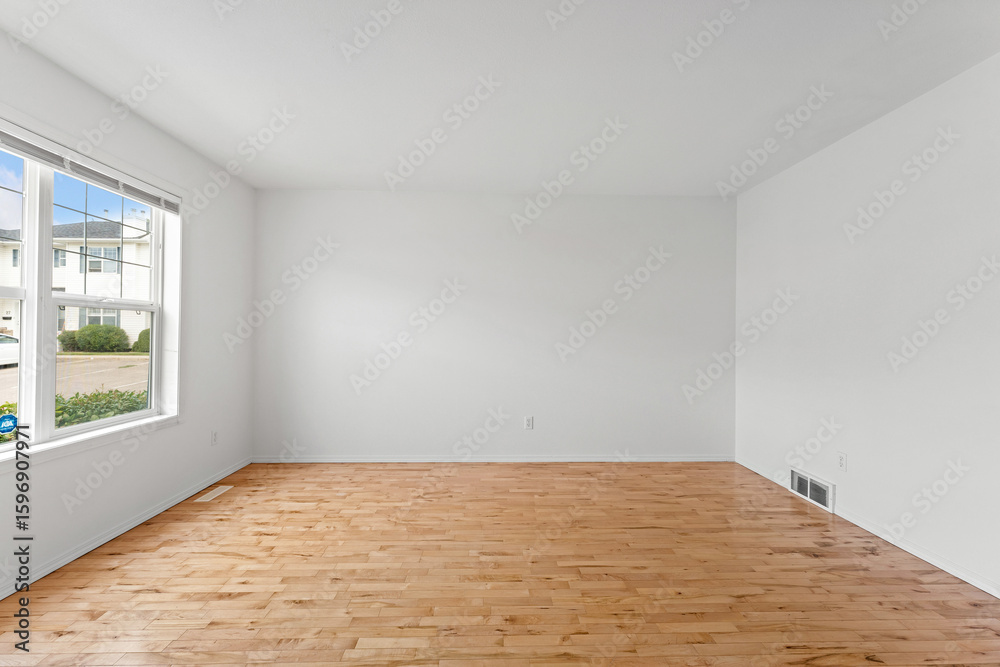 Obraz premium Large empty room with a window and a white wall