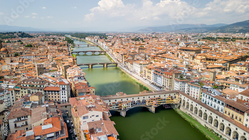 Fototapeta Naklejka Na Ścianę i Meble -  The Arno River and the Italian city of Florence on both banks of the river. 