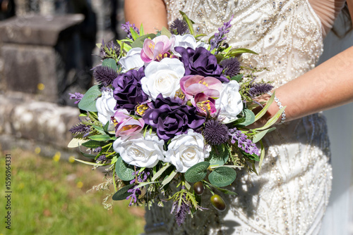 bride holding bouquet of flowers