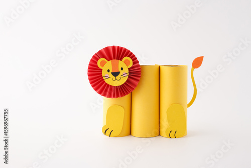 DIY lion pencil holder made from paper roll and scissors, fun educational activity for children, great for art classes, kids content, sustainable design, or creative workshops