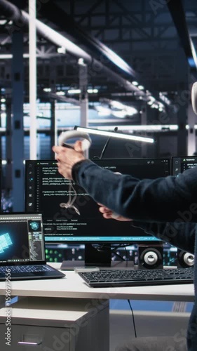 Vertical video Data center engineer using virtual reality, working on neural network software development. IT expert in server room using VR equipment, implementing machine learning technology, camera