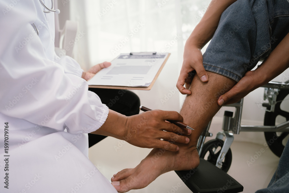 Fototapeta premium A doctor gently places a hand on a patient's knee, who is seated in a wheelchair, while holding a clipboard, signifying medical consultation and care.