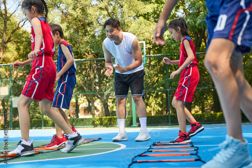 Kids Warming Up During Basketball Training Class