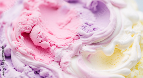 Swirled scoops of pastel-colored ice cream: A close-up shot reveals the beautiful texture and vibrant hues of a delicious dessert