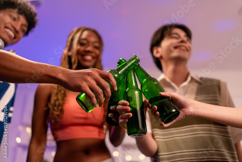 Wall Mural Group of diverse Generation Z friends enjoying a party in a cozy house