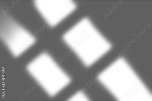 Diagonal white light rays shining across a dark textured background creating dramatic shadows