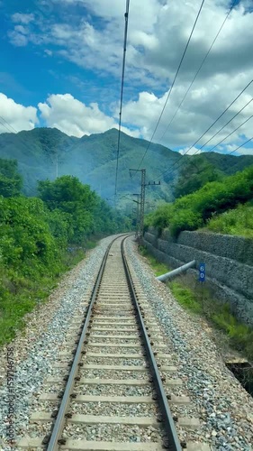 Railway track in the middle of forest in the mountain.  Train railroad in the rural area in South Korea