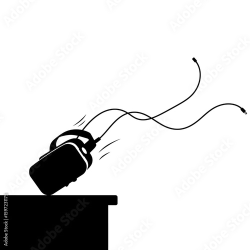 Falling VR Headset Silhouette with Cables and Motion Lines on Table