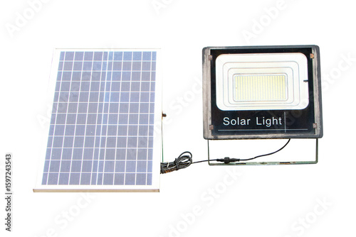 Fototapeta Naklejka Na Ścianę i Meble -  Spotlight with solar panel isolated on cut out PNG or transparent background. Saving electricity by sunlight solar energy as renewable energy clean from natural.	Solar panel small with light bulb.