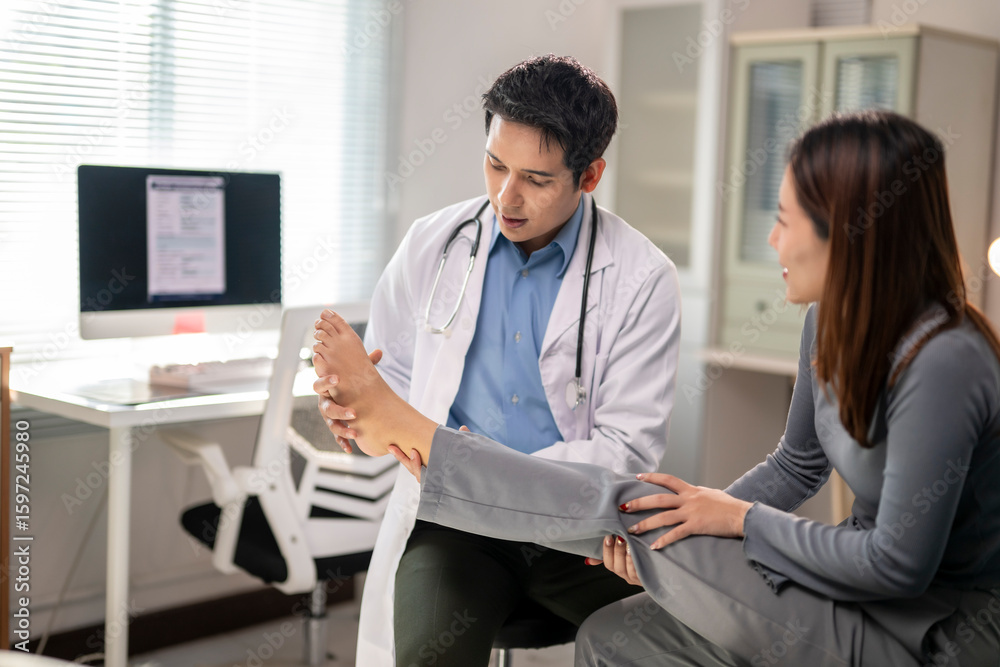 Fototapeta premium doctor is examining a woman's foot