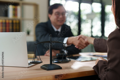Lawyers and business people discuss legal matters in the office.