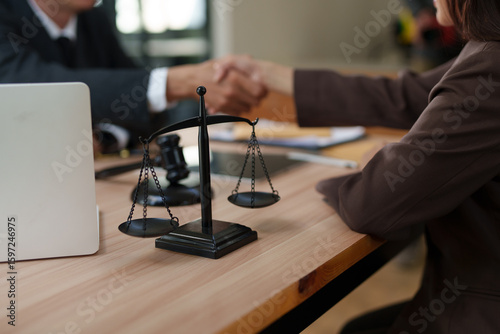 Lawyers and business people discuss legal matters in the office.