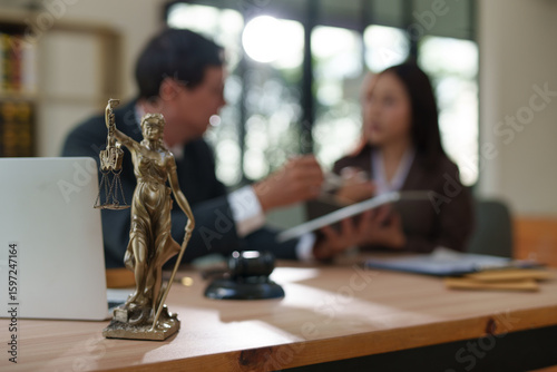 Lawyers and business people discuss legal matters in the office.