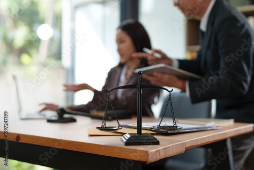 Lawyers and business people discuss legal matters in the office.