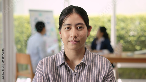 The way forward save the planet earth Gen Z female asia people go green net zero waste ESG office desk. Portrait headshot face young adult woman asian SDGs auditor work look at camera smile happy.