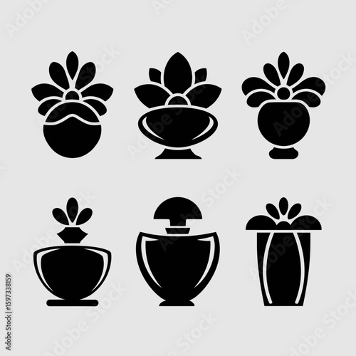 Collection of elegant perfume bottle silhouettes with floral accents isolated on white background