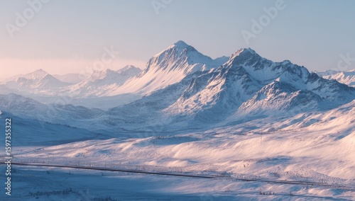 Snowy mountain range panorama at dawn