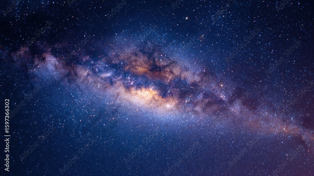 Fototapeta premium This breathtaking image showcases a spiral galaxy illuminated against a deep blue night sky filled with countless shining stars. It highlights the vastness and magnificence of the cosmos.