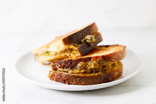 Grilled tuna and cheese sandwiches on sourdough bread.