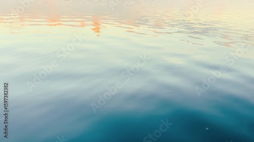 View of a Crystal clear water texture. Natural background. Ripple water reflection. Waves. Waves in motion with splashes at sunset	