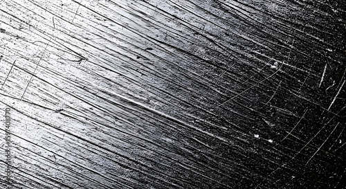 Abstract monochrome texture with diagonal striations and markings. Detailed surface pattern showcasing a variety of marks and scratches.