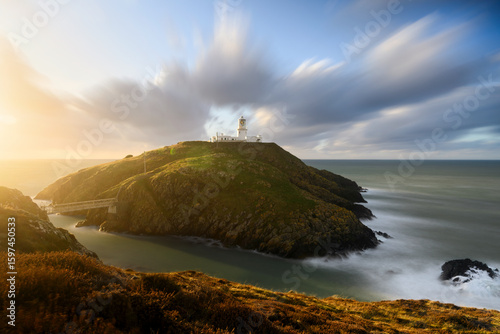 Panoramic Long Exposure View of Strumble Head Lighthouse in Wales with Spectacular Sunset