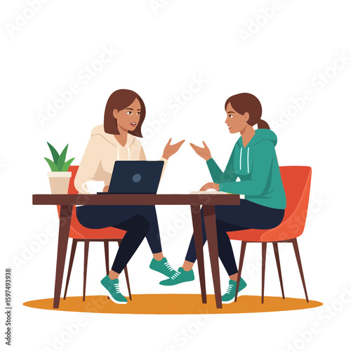 Two women seated at a table, engaged in a discussion, possibly a business meeting, using a laptop.