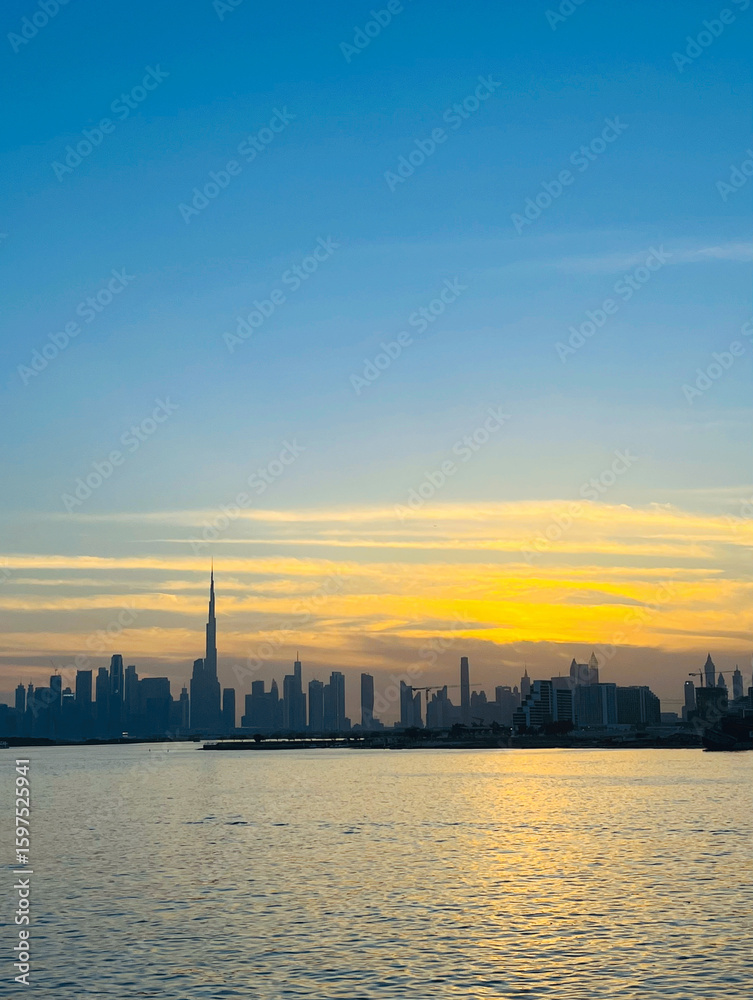 Obraz premium Dubai Creek Harbor View of Burj Khalifa and Sunset